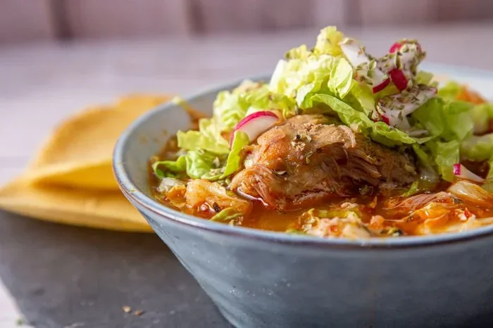 Which Topping Is Often Added to a Big Bowl of Pozole